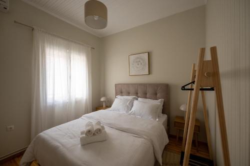 Postel nebo postele na pokoji v ubytování Tsagris Guest House