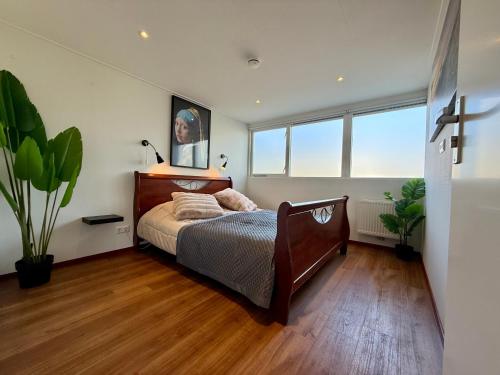 Ένα ή περισσότερα κρεβάτια σε δωμάτιο στο Holiday Home Vijfhuizen 2pers