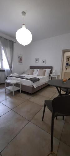 Postel nebo postele na pokoji v ubytování Efebo Rooms