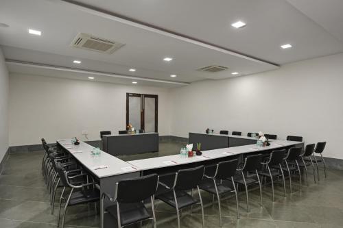 a large conference room with a long table and chairs at Anandam - A Luxury Resort in Udaipur in Udaipur