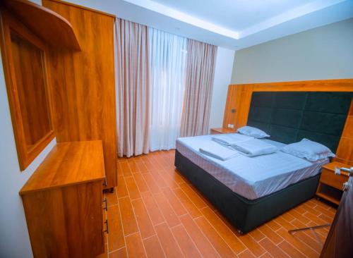 Postel nebo postele na pokoji v ubytování Jikoni Hotel