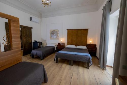 Postel nebo postele na pokoji v ubytování B&B Domus Enna