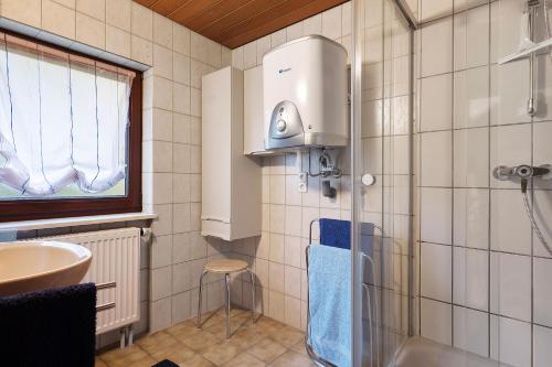 a bathroom with a shower and a sink at Haus an der Landhege in Mainhardt
