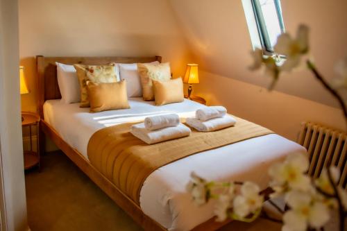 Letto o letti in una camera di The Old Palace Lodge