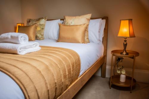 Letto o letti in una camera di The Old Palace Lodge