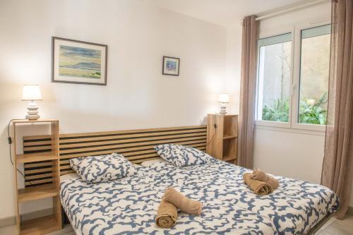 Postel nebo postele na pokoji v ubytování Maison Leucate Vue Mer Les Grandes Terrasses
