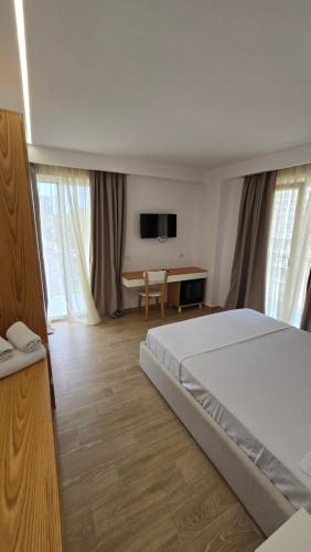 Postel nebo postele na pokoji v ubytování Alcani Hotel