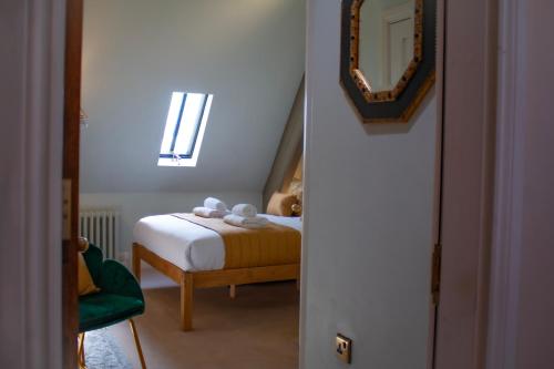 Letto o letti in una camera di The Old Palace Lodge