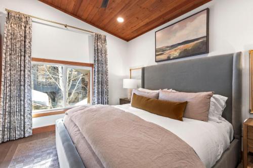 a bedroom with a large bed and a window at KBM Resorts Upgraded Easy walk to Main St Close to Deer Valley hot tub gas fireplace BCC-1101 in Park City