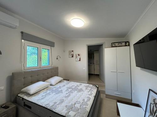 Ein Bett oder Betten in einem Zimmer der Unterkunft Κτημα Εριφυλλη