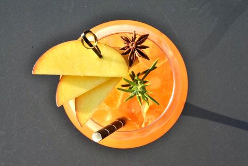 a orange plate with a piece of food on it at Hotel Belvedere Ranco in Ranco