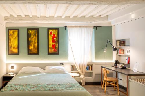 Postel nebo postele na pokoji v ubytování Duccio Nacci Rooms- Guesthouse