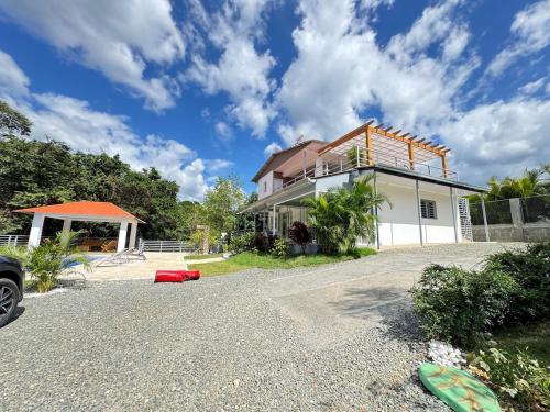 a house on the side of a road at villa el naciente in La Cuaba