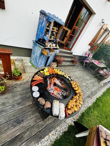 a fire pit in front of a house at Vila Zvonica - 3 minúty od Starý Smokovec in Nová Lesná
