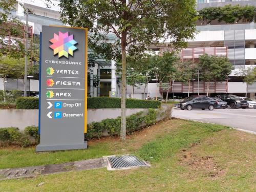 a sign in the grass in front of a building at C-25-06 Lakeviewsouth Cybersquare WiFi Netflix FreeParking in Cyberjaya