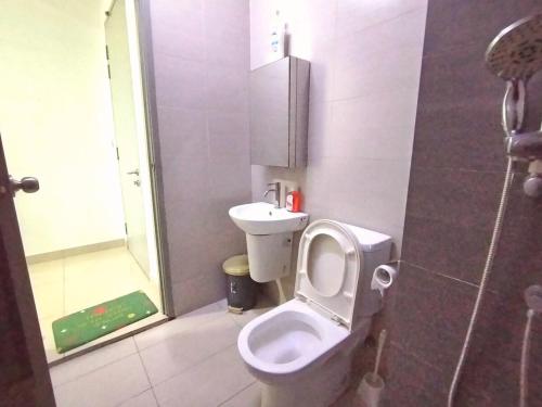 a small bathroom with a toilet and a sink at C-25-06 Lakeviewsouth Cybersquare WiFi Netflix FreeParking in Cyberjaya