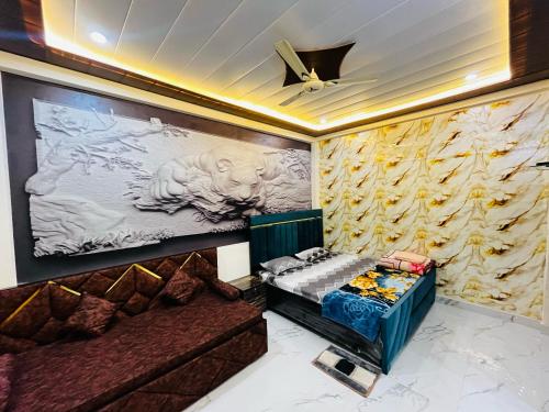a room with a bed and a painting on the wall at Ram Bhawan HomeStay in Vrindāvan