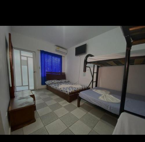 Postel nebo postele na pokoji v ubytování Hotel Los Delfines Melgar