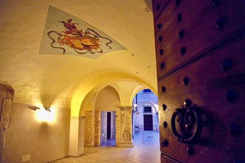 a hallway in a building with a painting on the ceiling at The Poets' Retreat in Sulmona