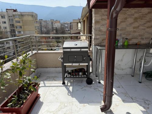 a grill sitting on a balcony on a building at Apartment near Vitosha mountain, self check-in, with underground parking in Sofia