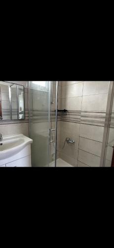 a bathroom with a shower and a sink at House Dino & Telma in Machico