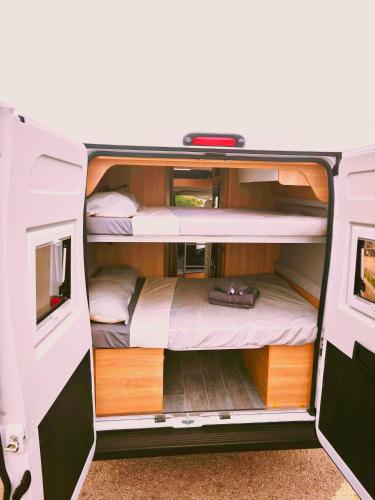an interior view of an rv with two bunk beds at Menorca van life in Ciutadella
