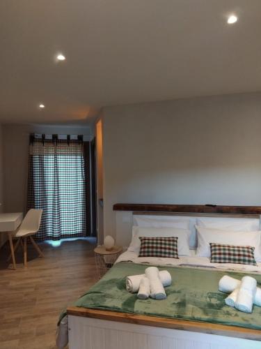 a bedroom with a large bed with two pillows on it at Bed & Breakfast 'Ngre in Moncrivello