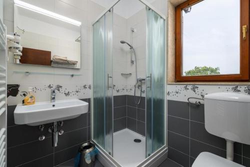 a bathroom with a shower and a sink at Holiday house Lera Rovinj, with football field, sauna, jacuzzi in Rovinj