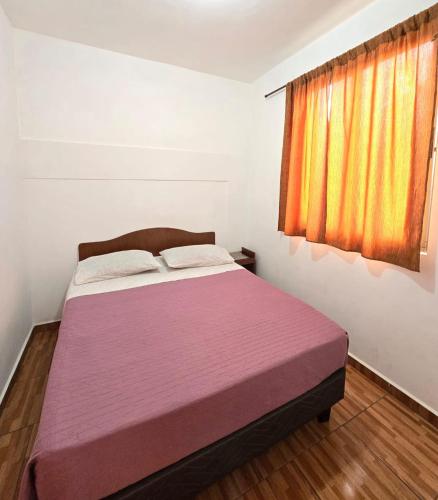 Postel nebo postele na pokoji v ubytování Hostal Las Cruces