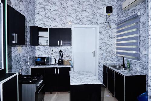 Kuchyň nebo kuchyňský kout v ubytování Tee-whyte private home