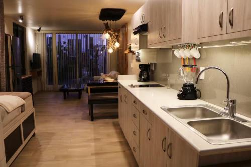 a kitchen with a sink and a counter top at Centro Hannah in Morelia