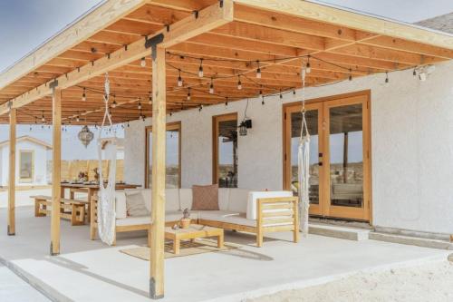 a wooden pavilion on the patio of a house at Loma Vista By The Cohost Company in Sunfair Heights