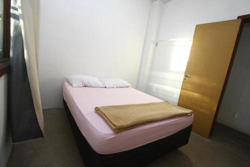 Katil atau katil-katil dalam bilik di Trilhas de Minas Hostel Camping