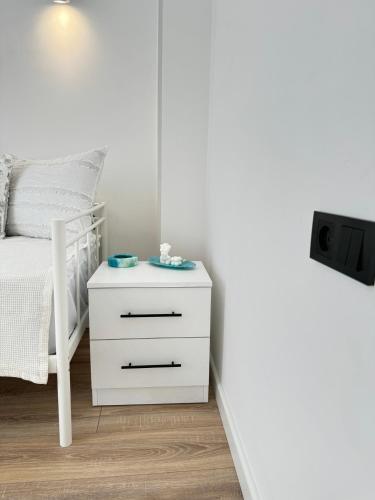 a bedroom with a bed and a white nightstand at SamMar B&B in Ashtarak