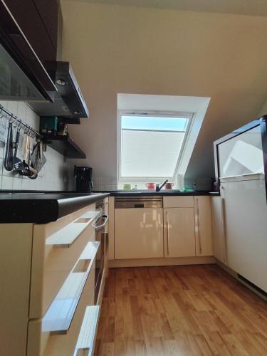 a kitchen with a window and a counter top at Ferienwohnung Schultz in Zinnowitz