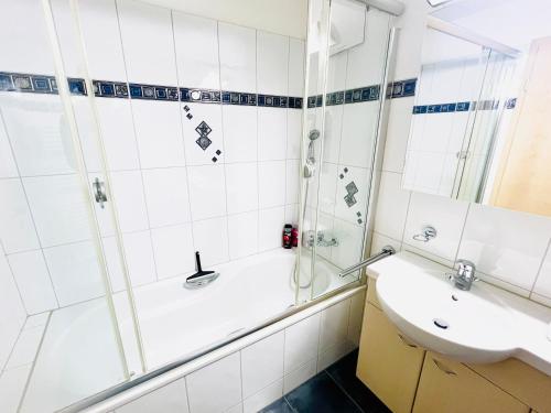 a bathroom with a shower and a sink at Workation Apartments - Rigiblick - Modern Apartment - 8 Pax - 20 Min to Zug in Arth