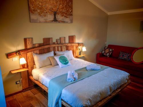 a bedroom with a bed with towels on it at Agriturismo Podere Orzale Hospitality & Quarter Horses in Usigliano