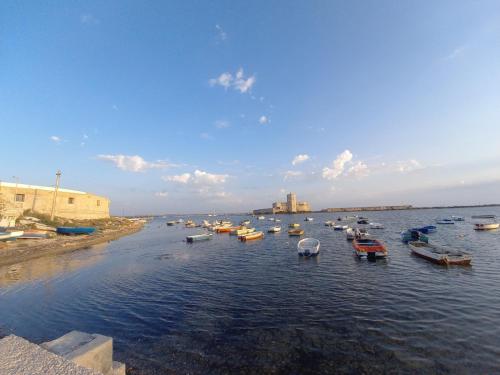 a group of boats in a body of water at Sweet home in Casa Santa