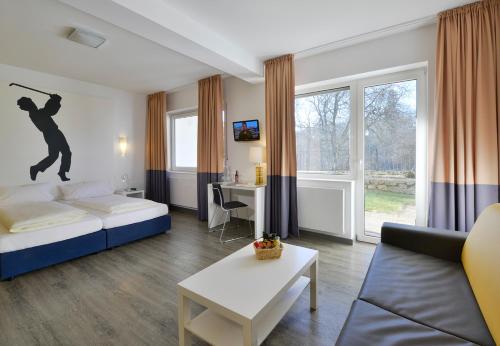 Ένα ή περισσότερα κρεβάτια σε δωμάτιο στο Hotel Alte Schule
