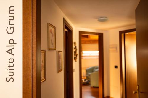 a hallway leading to a living room with a hallway at Bernina Express Eco Rooms&Breakfast in Tirano