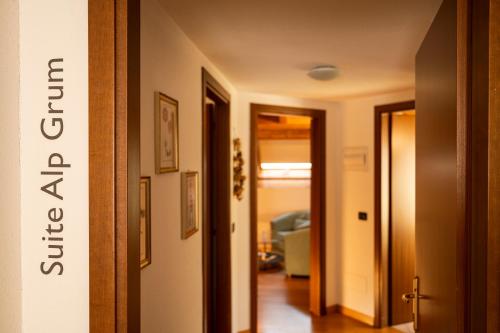 a hallway with a door leading into a room at Bernina Express Eco Rooms&Breakfast in Tirano