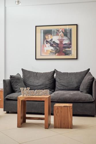 a living room with a couch and a coffee table at Angel's Villa in Kato Gouves