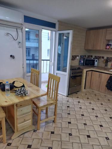 Kuchyň nebo kuchyňský kout v ubytování Petit appartement sympa