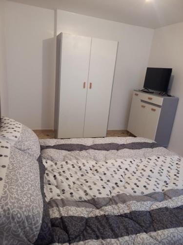 Postel nebo postele na pokoji v ubytování Petit appartement sympa