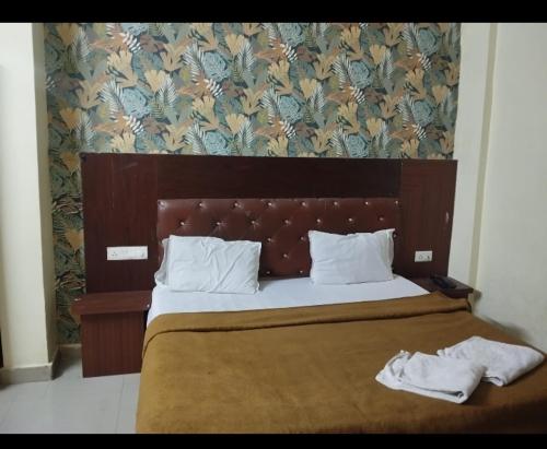 Postel nebo postele na pokoji v ubytování Hotel dolphin