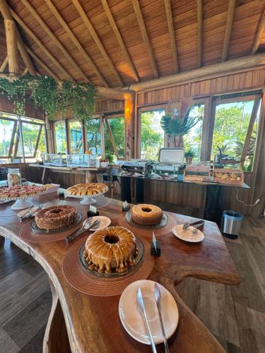 a long table with many different types of food on it at Village Muta in Porto Seguro