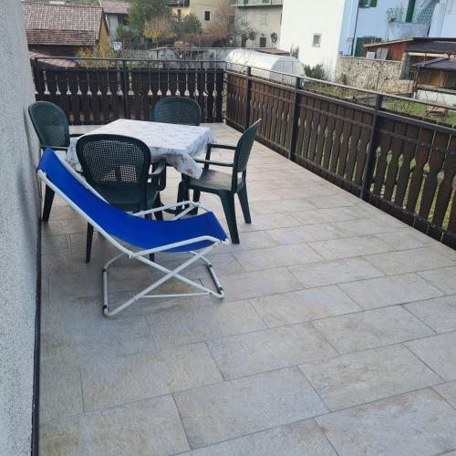 a table and chairs sitting on a patio at Bioledro - Casa Lena in Mezzolago