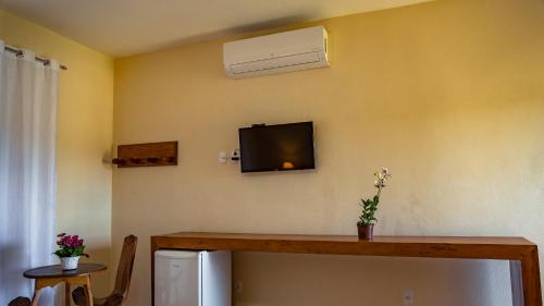 TV a/nebo společenská místnost v ubytování Pousada Charme Tiradentes