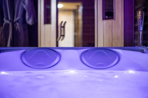 a pair of sunglasses sitting on top of a table at Le Chalet des Amoureux SPA Sauna in Lozinghem