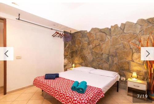 Ένα ή περισσότερα κρεβάτια σε δωμάτιο στο Cavalluccio Marino